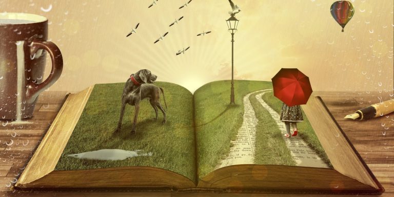 open book page with grass and path with person holding umbrella and dog, book on table with mug